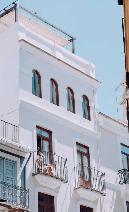 the building is white and has blue doors