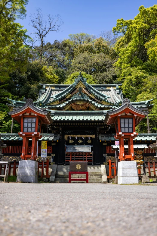 a traditional japanese building with trees in the background