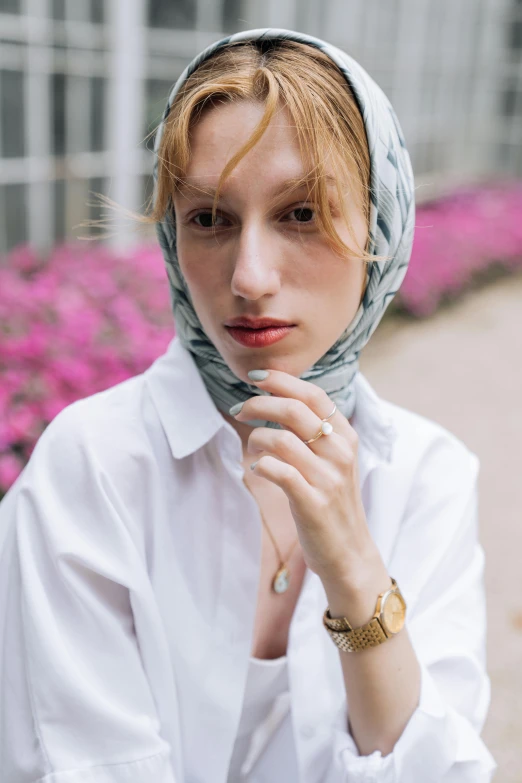 a woman with short hair and a headscarf