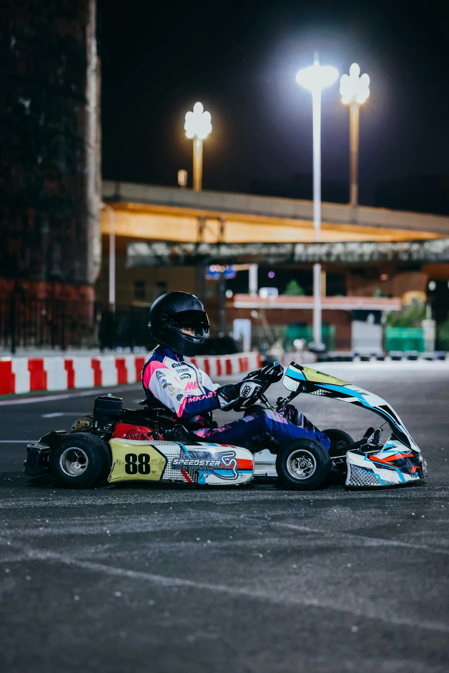 a person riding a go kart in front of an entrance