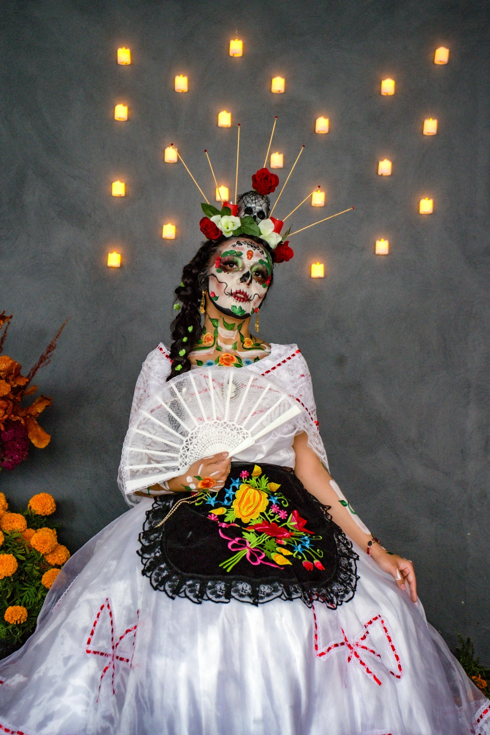 a woman with day of the dead makeup and face paint