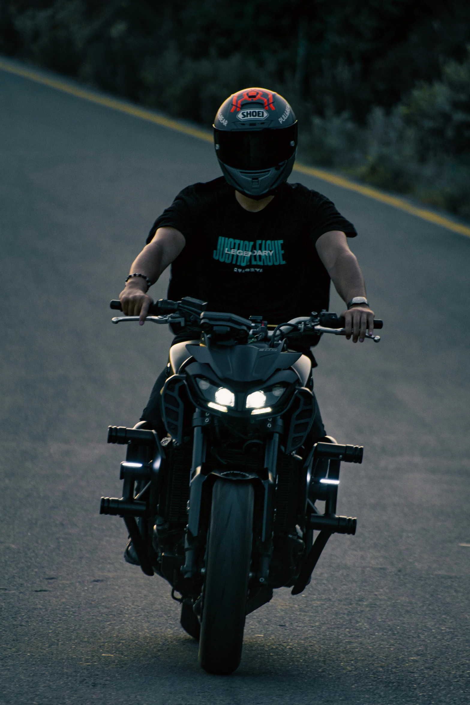 the man in a helmet rides his motorcycle on the street