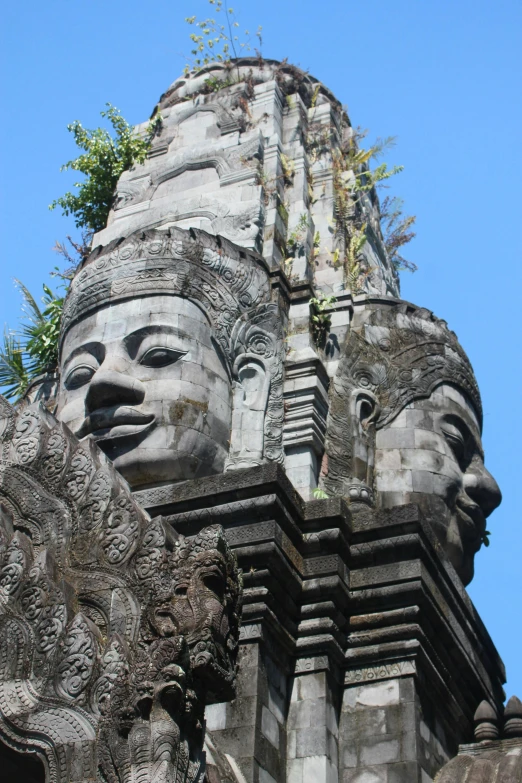 a tall statue on top of a building