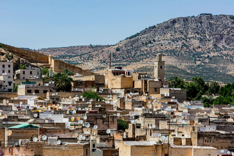 view of a mountain with buildings in front