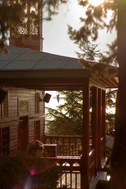 a gazebo sitting in front of the gazebo is next to a house