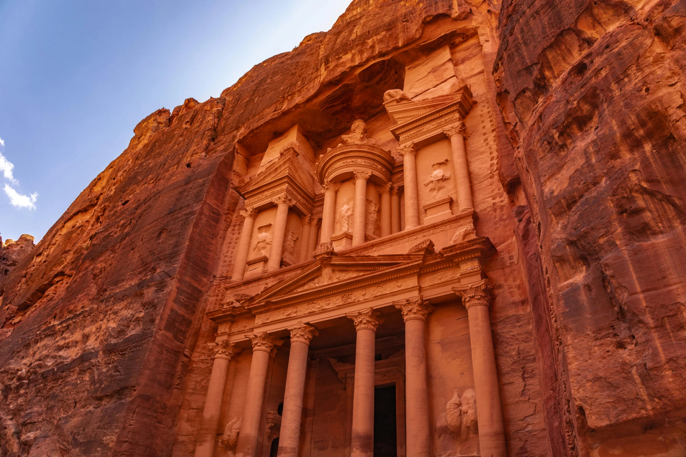 the stone building has pillars in front of it