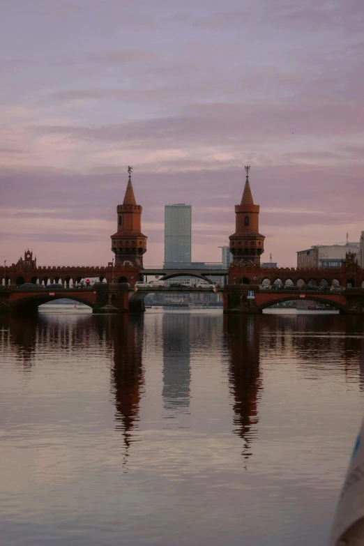 a body of water that has a bridge on top of it