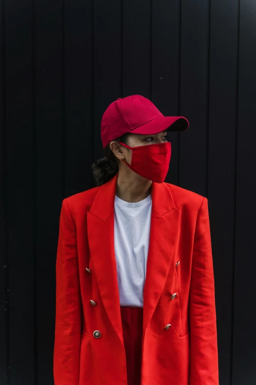 a woman with a face mask in red