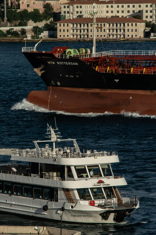 two ships traveling side by side in a body of water