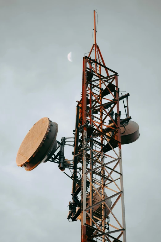 an antenna tower is up in the sky