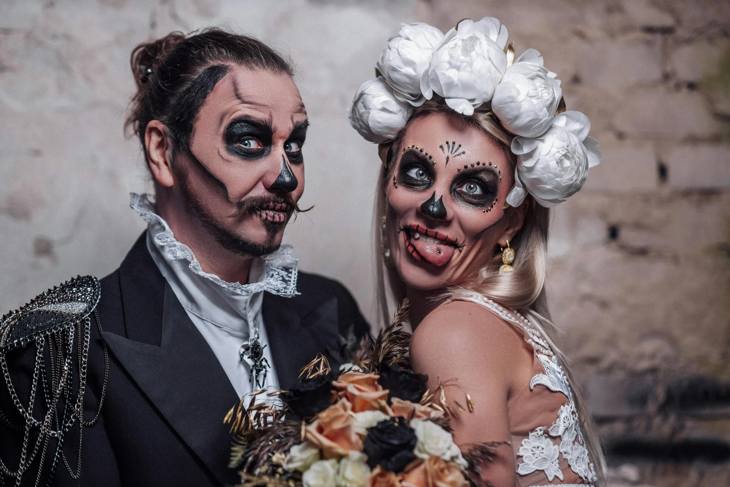 a man and woman dressed in costume pose for the camera