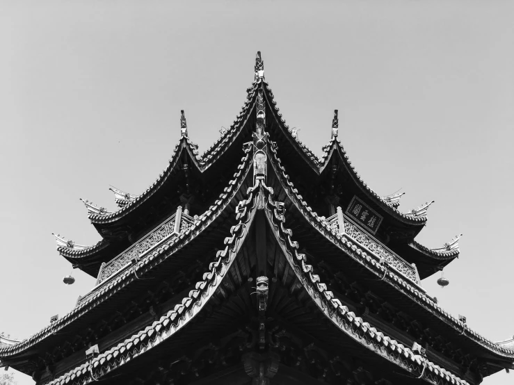 an image of the sky from underneath a pagoda