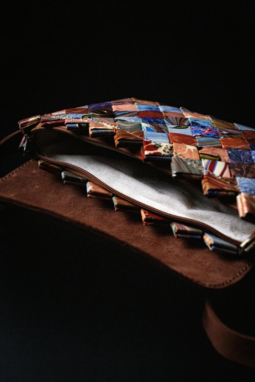 a pair of scissors laying on top of a wooden  board