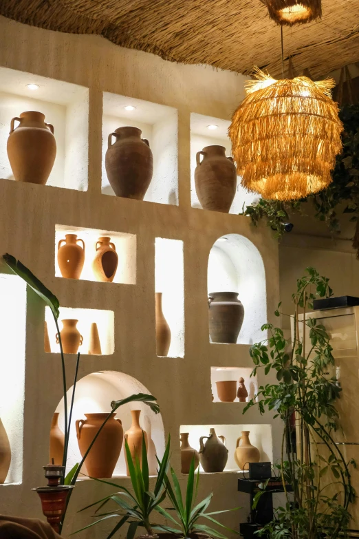 pots are arranged on shelves to display various items