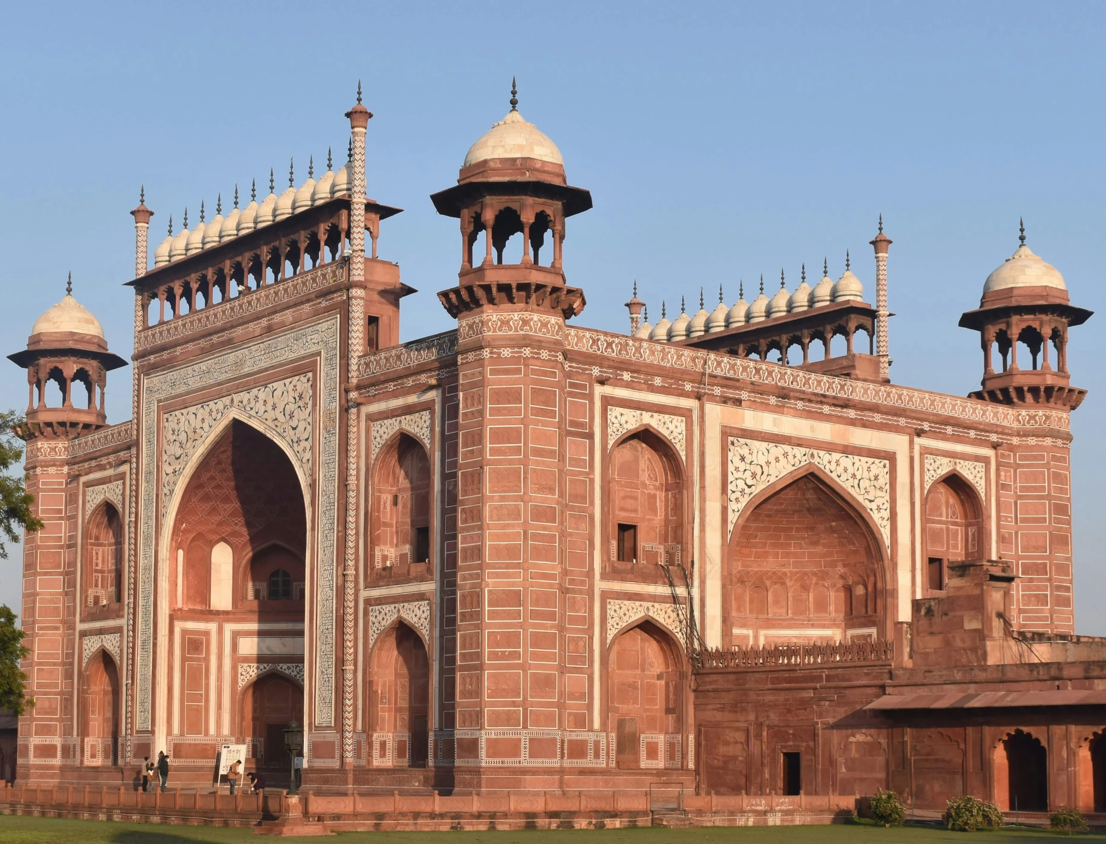 a large building with three towers built on top of it