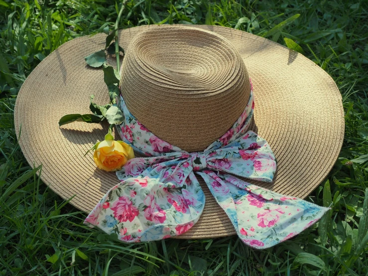 a hat with a blue and red flower on it