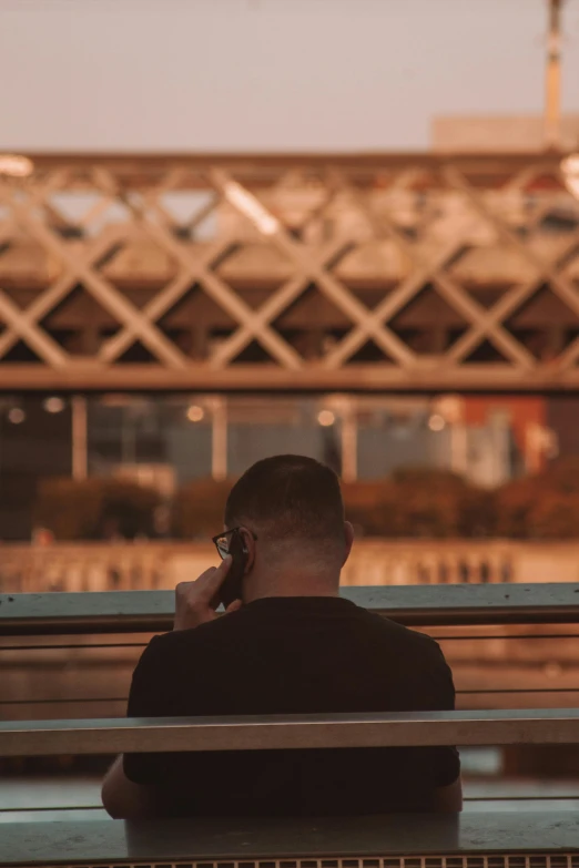 man on phone in front of an empty building