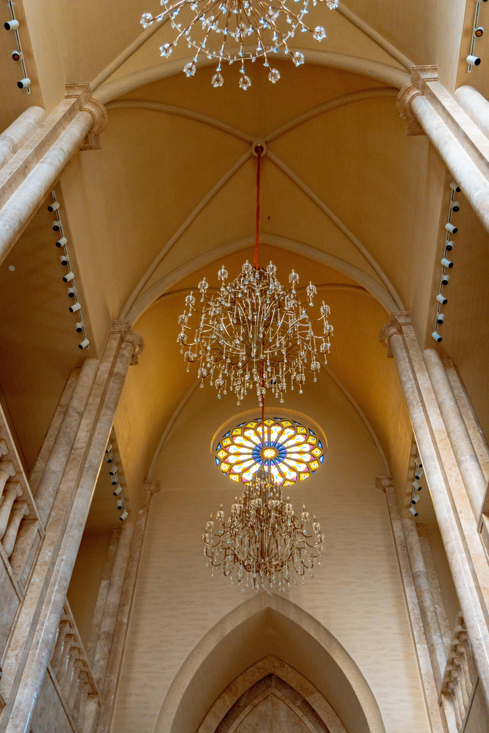 a large chandelier hanging from the ceiling in a building