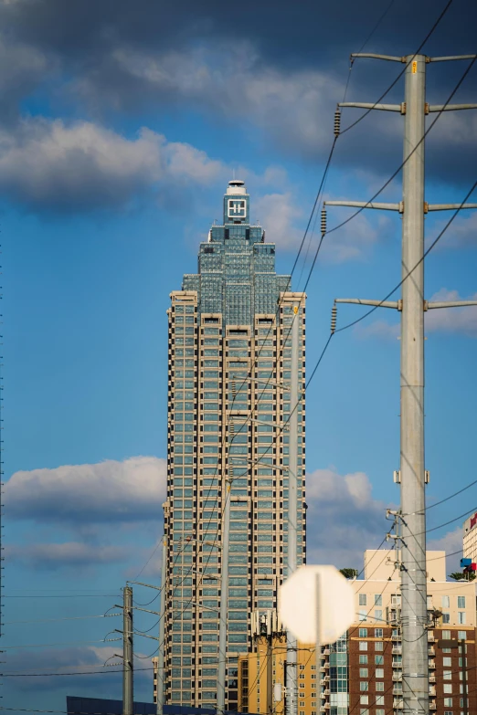 a clock on the top of a building with buildings in the background