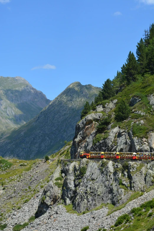 a train that is sitting on the side of a mountain