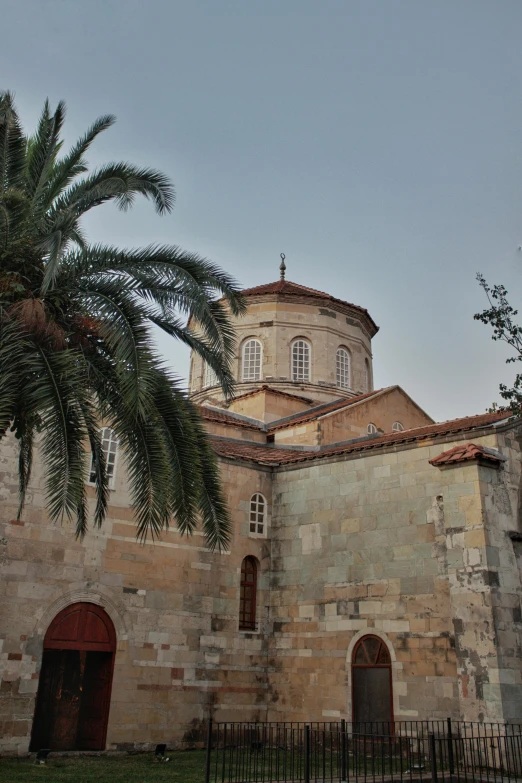 an old building with several arches next to it