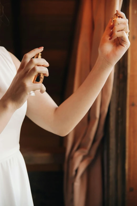 a woman is holding onto some sort of glass