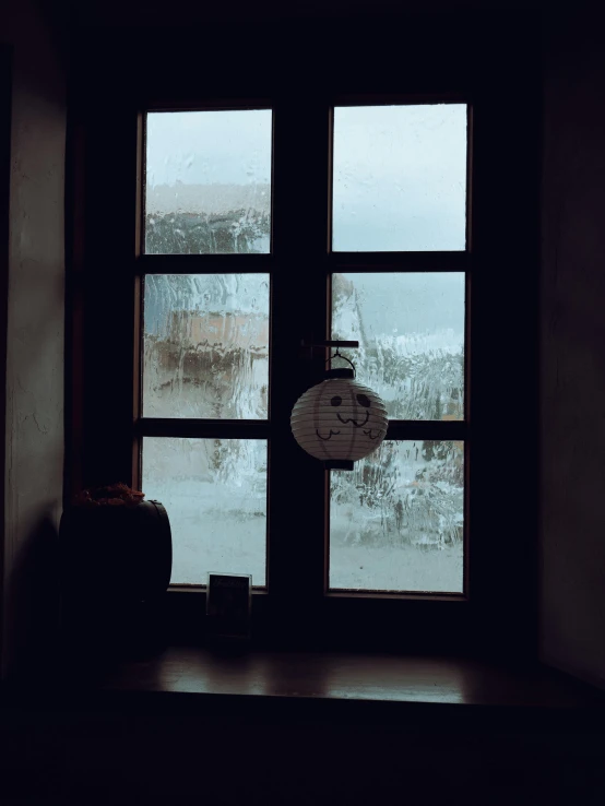 the clock is placed next to the closed window