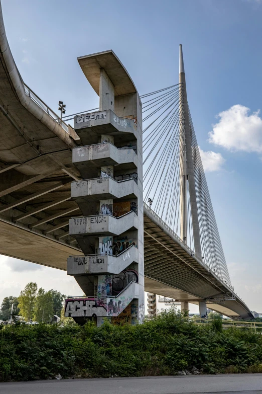 a large building has a bridge with many balconies