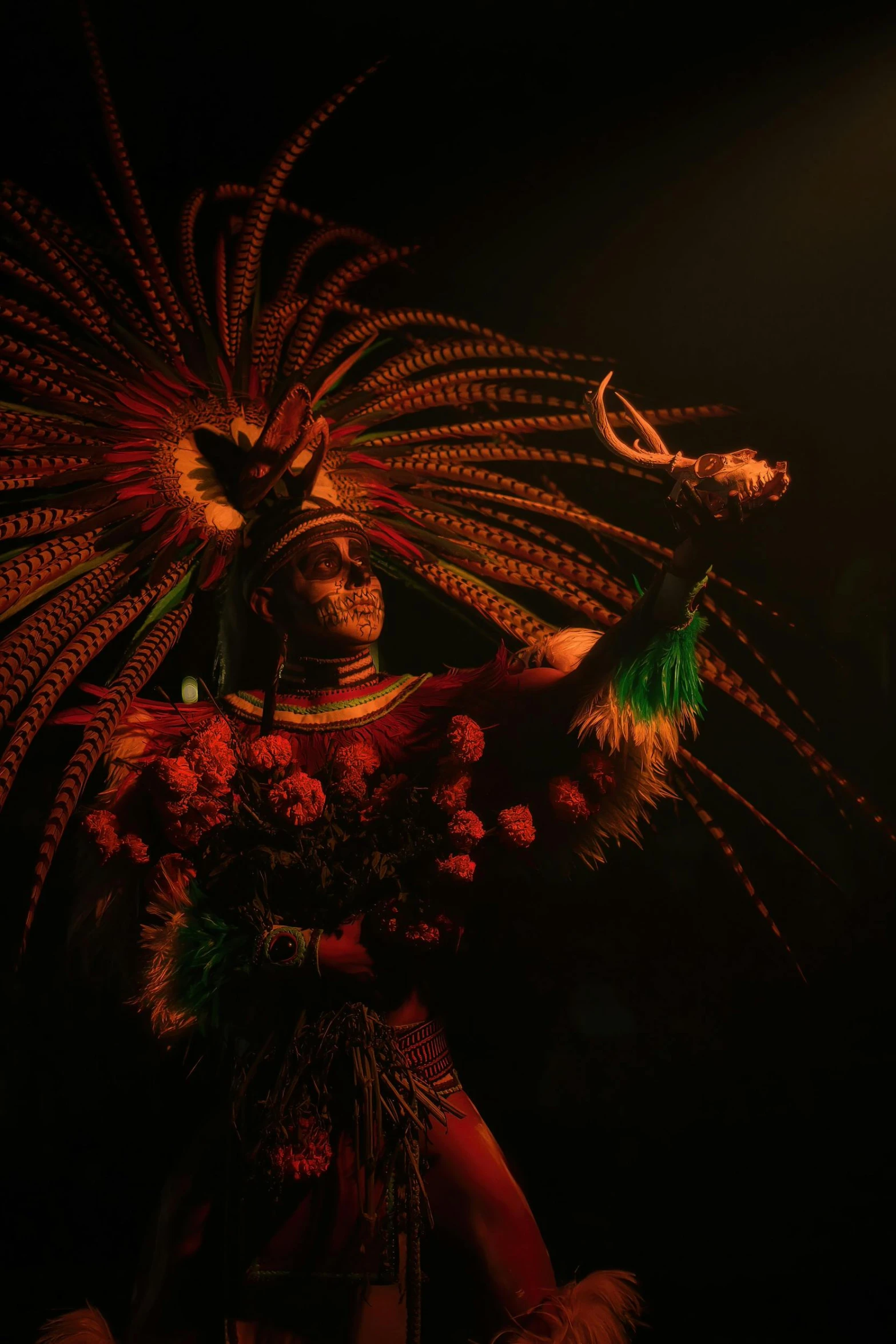 an asian dancer in a black background with fireworks