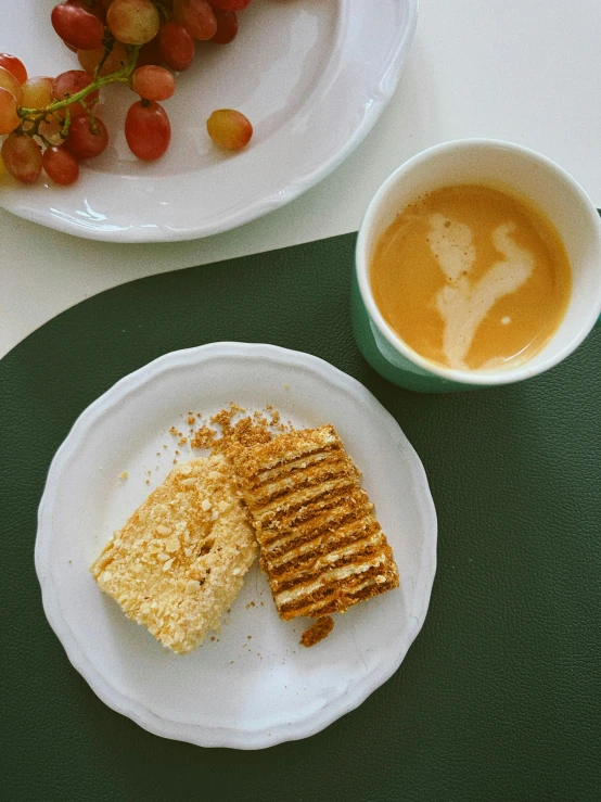 a plate with some food and a cup of coffee