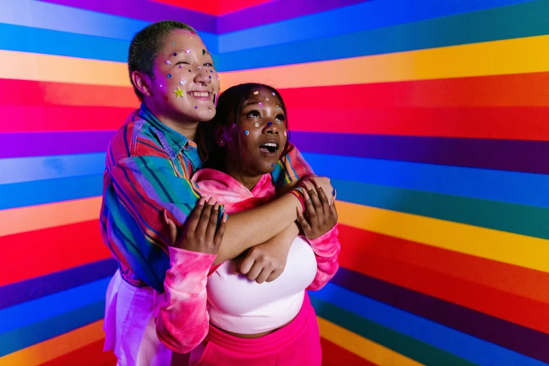 a couple in colorful art holding each other