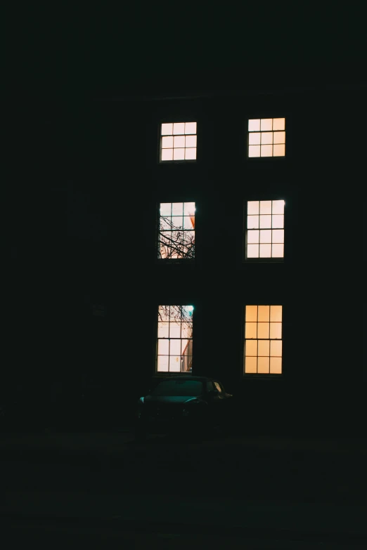 a car in the dark looking out of two windows