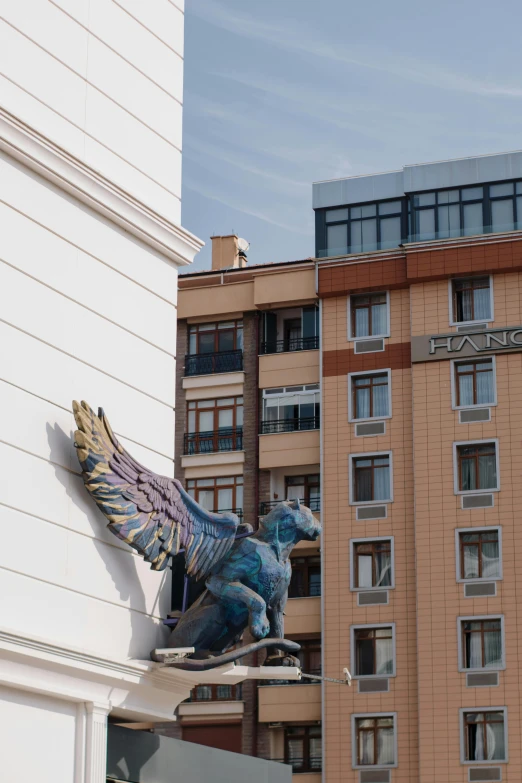 a statue of an angel on top of a building