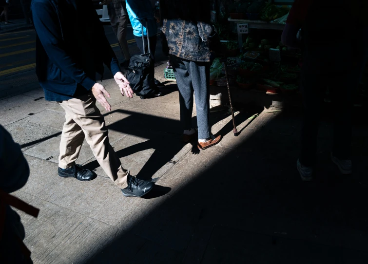 the shadow from two people holding their hand