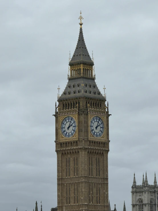 a big clock tower with the big ben in the background