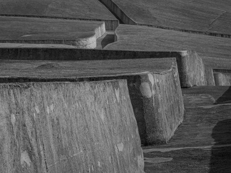 a black and white pograph of a row of cement structures