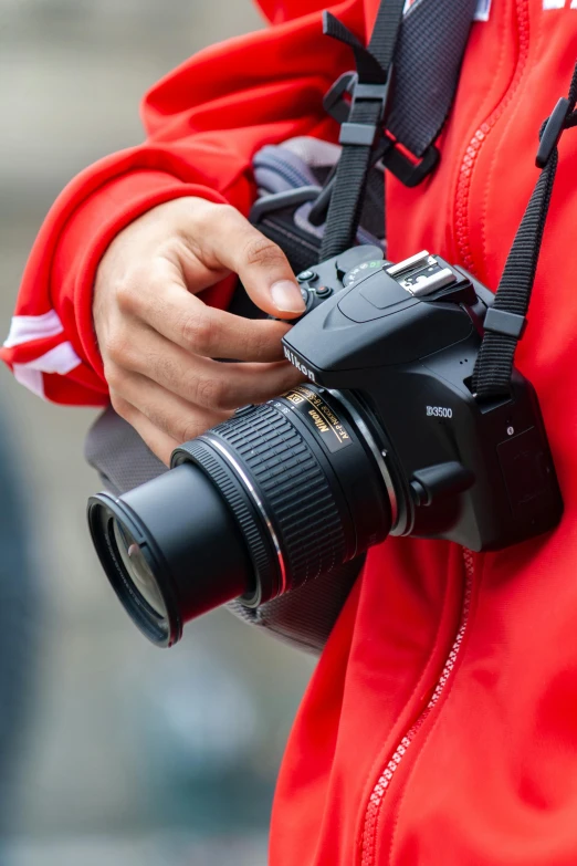 a pographer holding his camera taking a picture