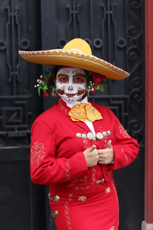 a woman with mexican makeup and a sombrero