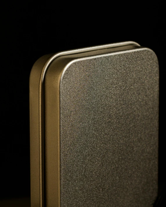 a gold colored metal case with no lining