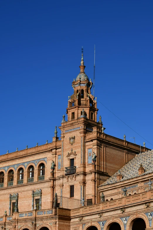 a tall building sitting on top of a blue sky