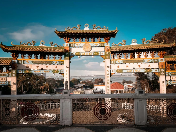 an archway leading into a large city