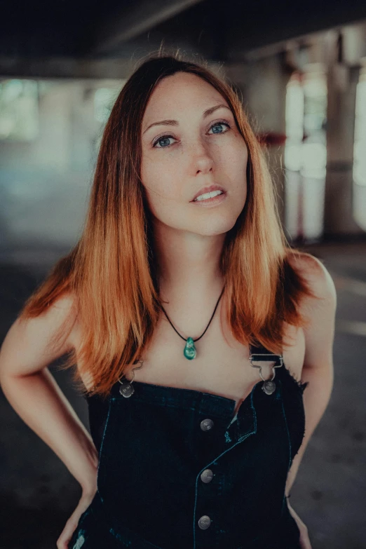 the woman is posing in a black dress