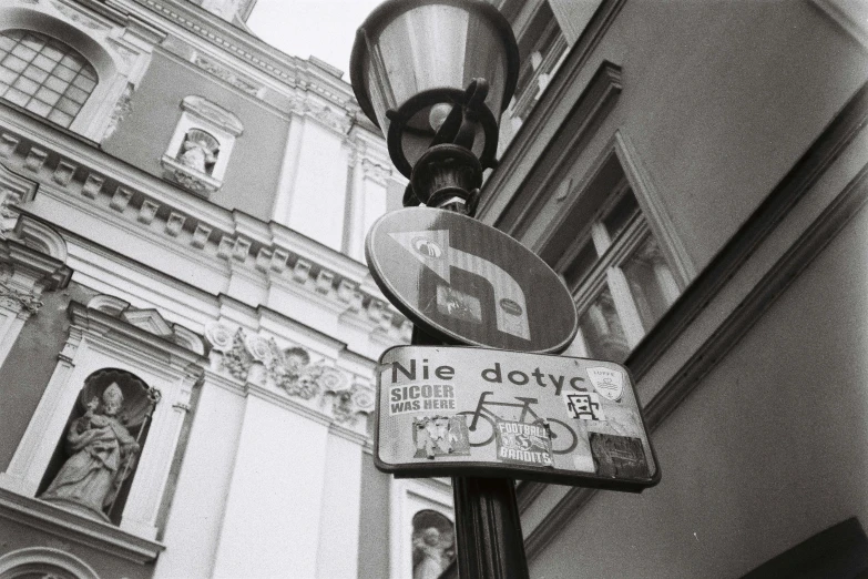 a couple of street signs sitting on top of a pole