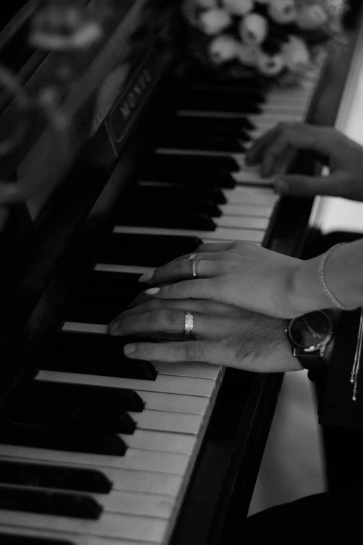 someone sitting in front of a grand piano