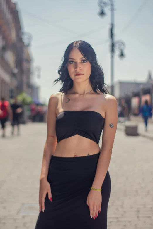 a beautiful young woman wearing a black bikini top