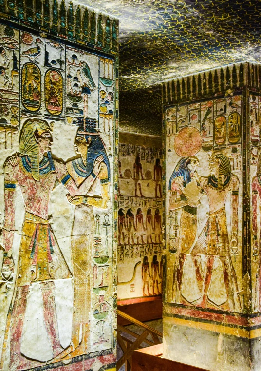 an ancient painted room with decorative paintings and paintings on the wall