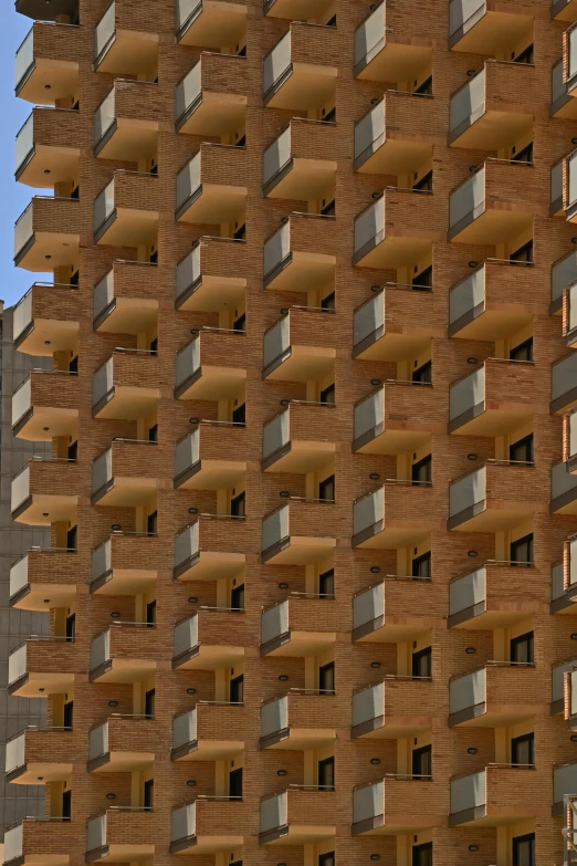 a very tall building with balconies on the sides