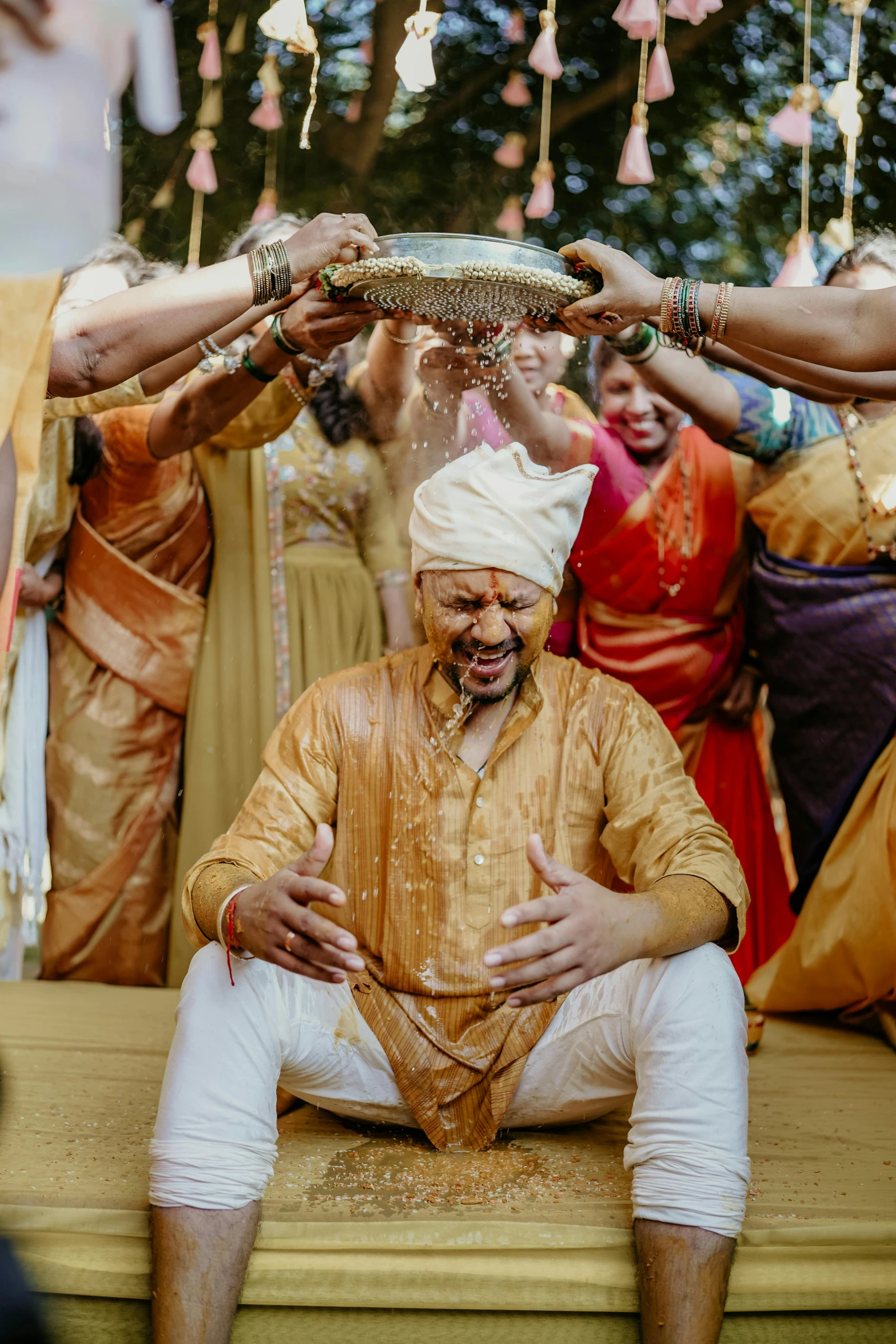 indian men and women performing wedding dance