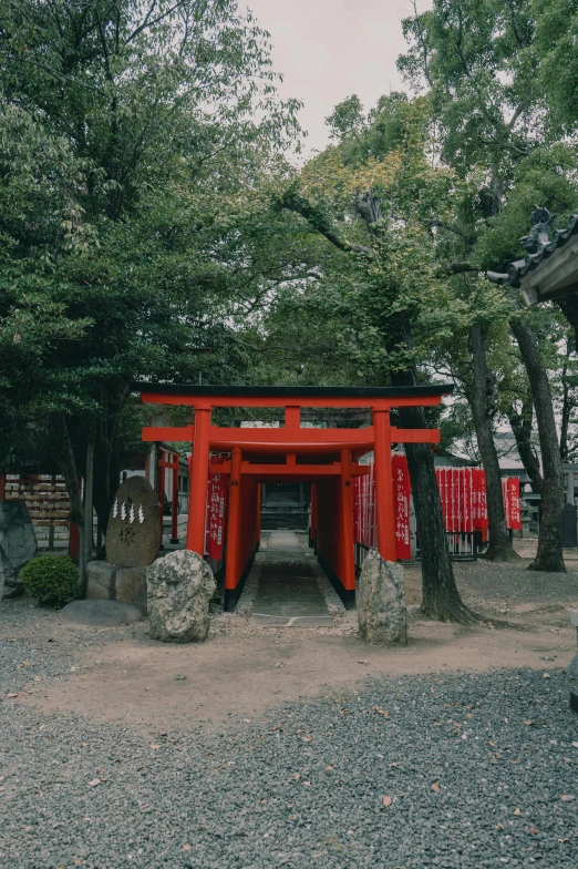 the gate to an outdoor shrine in the park