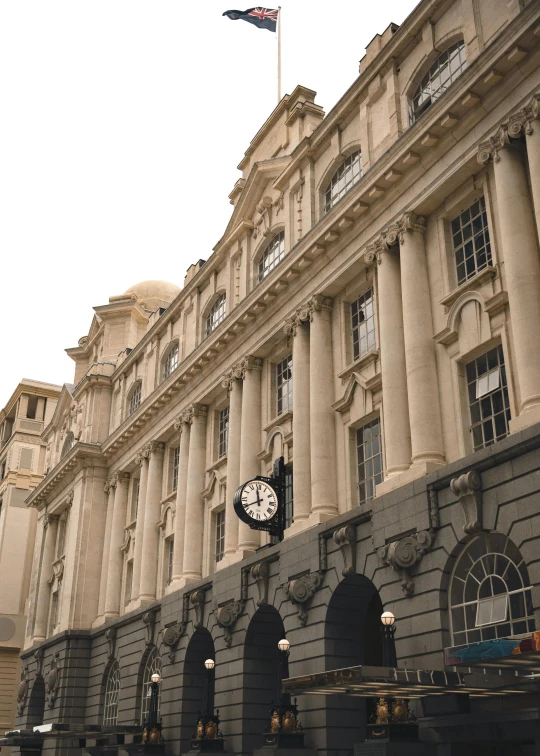 a clock sits in front of the royal palace